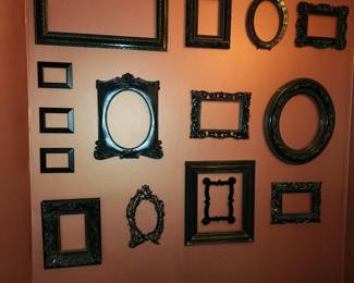 Picture frames velcroed to the wall 