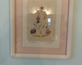. . . a signed floral piece