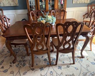 . . . beautiful formal dining table and eight chairs