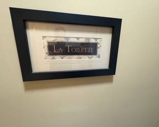 . . . I'm going to take a wild guess -- "La Toilette" means "the toilet" -- I could be wrong. . .