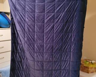 Weighted Blanket And A Bevy Of Throw Pillows In A Tub