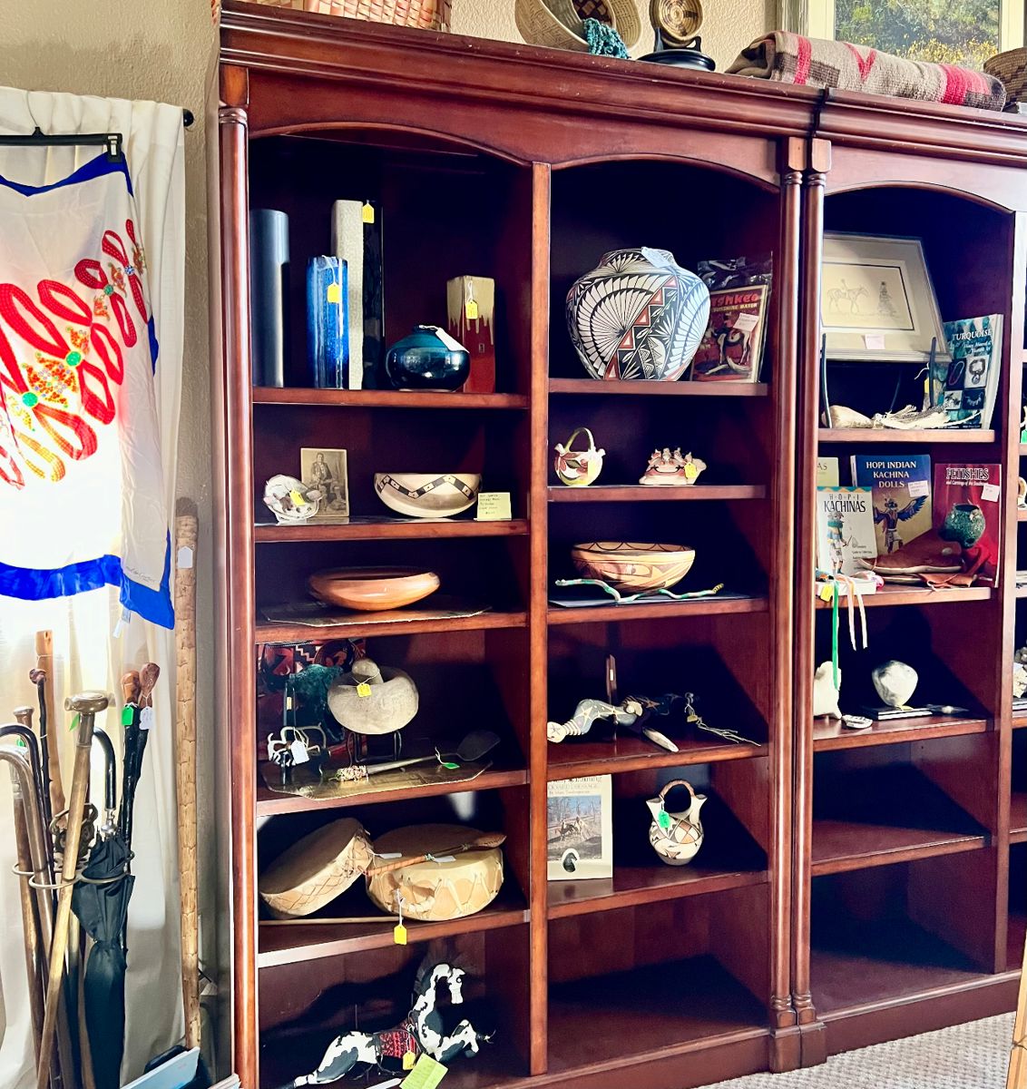 Cartier Scarf, Bookcase full of Native American Pottery, drums, Books, Medicine Stick and more
