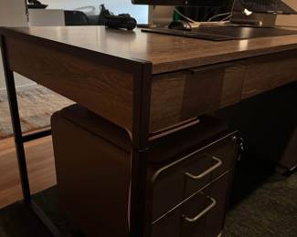 Only 1 year old - Large, modern writing desk - Sleek shape and timeless look - Black iron base - Keyboard tray - 3 Drawers with soft-close - Finished back - Functional and good looking - Solid Hardwood, Brown - Fits multiple monitors
- No flaws or scuffs, in perfect condition
Measurements = 30” tall 62” wide 30” deep - $450 + tax.