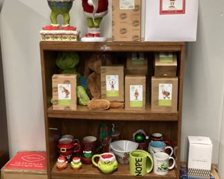 CABINET FULL OF DR. SEUSS CHRISTMAS GRINCH COLLECTIBLES, PLACE MATS, CLOTHING, JIM SHORE ORNAMENTS, GLASSWARE, FIGURINES, PLATES