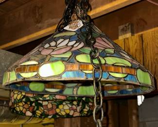Vintage leaded glass hanging light, purchased about 15 years ago at TGI Friday’s redecorating sale! We have 4–all different, all beautiful!