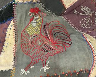 Antique crazy quilt (small, more like a throw) with elaborate embroidery and stitching—damaged areas of fabric deterioration throughout