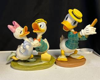 Collection mostly 90s WDCC (Walt Disney Classic Collectibles) porcelain figurines—assorted sizes and prices.