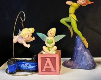 Collection mostly 90s WDCC (Walt Disney Classic Collectibles) porcelain figurines—assorted sizes and prices.