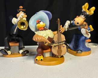 Collection mostly 90s WDCC (Walt Disney Classic Collectibles) porcelain figurines—assorted sizes and prices.