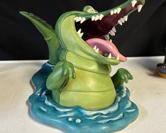Collection mostly 90s WDCC (Walt Disney Classic Collectibles) porcelain figurines—assorted sizes and prices.