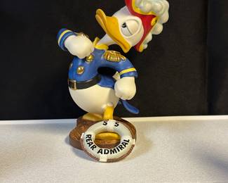 Collection mostly 90s WDCC (Walt Disney Classic Collectibles) porcelain figurines—assorted sizes and prices.