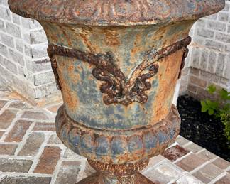 Pair of cast iron and urns
