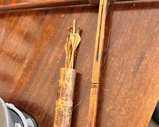Antique bow & arrows in quiver and German military hat