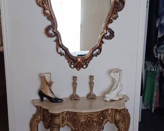 Ornate decorative French hall table and matching mirror.