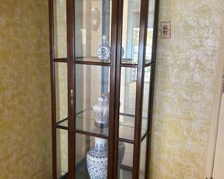 One of two lighted curio cabinets.