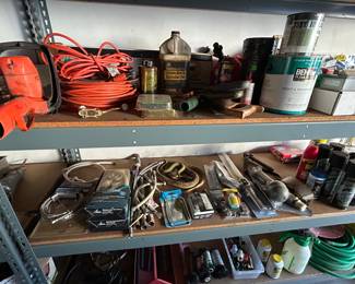 Garage full of tools and aquarium supplies.
