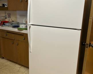 Packed kitchen- Whirlpool refrigerator.