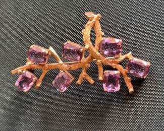 14k and gemstone broach.