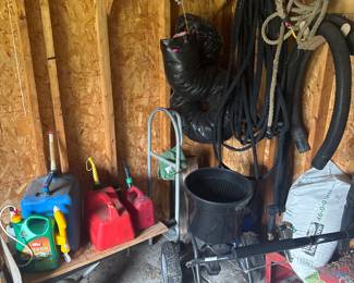 gasoline cans, seed spreader,