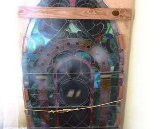Vintage stain glass window, 5 foot 10 inches tall and 36 inches wide, Center stain glass pane shows a picture of a Gothic Bible, has been in past owners' family since late 1800's. Very nice. This is a museum item. Bring your own help in loading. I will try to get better photo without moving item. Located in front room of home.