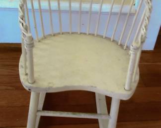 Wicker child's rocking chair. About two foot tall.