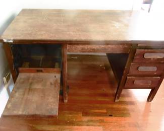 Solid oak desk with typewriter feature or can be used for laptops of PCs. Came from the Gulf Oil Company, has original Gulf inventory metal plate.