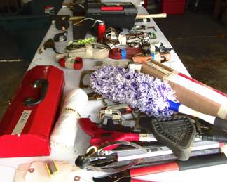 One table full of hand tools and misc..