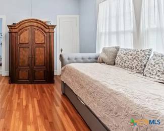 Trundle bed (no mattresses') Needs now twin size mattresses. Large wardrobe.