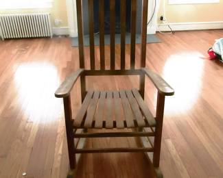 One of two front porch rocking chairs. Sold separate. Located in living room of home.