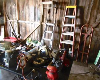 Ladders, dolly, and table full hand tools.
