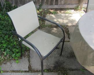 View of one of the patio chairs. Located in backyard.