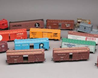 HO Scale Railcars, Including Union Pacific, Northern Pacific, and Central Vermont, along with distinctive designs like ‘Pluto Water’ and ‘Dairymen’s League’.