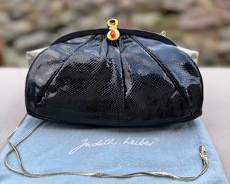 Judith Lieber black snake skin bag.