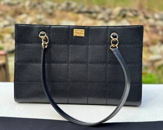 Chanel black leather Hershey bar caviar shopping tote shoulder bag.
Authentication verified.