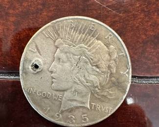 1935 silver dollar with hole punch
