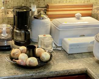 Small appliances, cutting boards, white storage containers