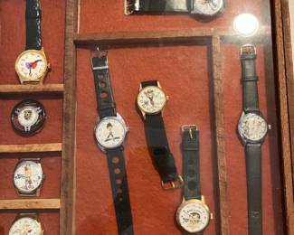 COLLAGE OF 1960-70s WATCHES:  POLITICAL, PORSCHE, STEERING WHEEL, RISQUÉ, POPEYE (SOLD AS A GROUP)