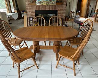 Solid oak table 72” x 42” plus 12” leaf & 6 chairs