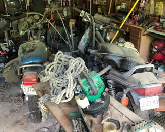 Suzuki motorcycle (left) and Honda motorcycle (right) for parts or restoration.