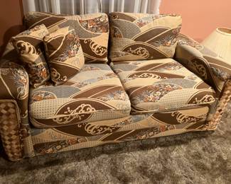 Loveseat with woven ends