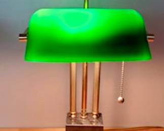 Vintage brass bankers lamp with cased green glass shade on marble base.