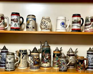 Vintage German beer steins and US mugs.