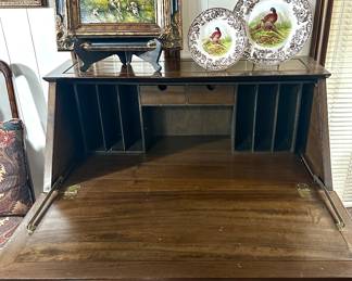 Rosewood Chinoiserie secretary. Intricately hand carved front and sides. Drop down writing surface.