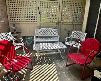 4-Piece Aluminum patio set, Two red mid-century patio chairs.