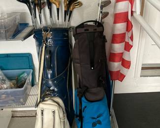 Golf Clubs and bags....some Pings, American flag
