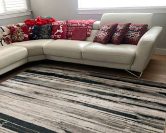 Nicoletti Leather Sectional, Christmas throw pillows and blankets, Area rug 8 x 10