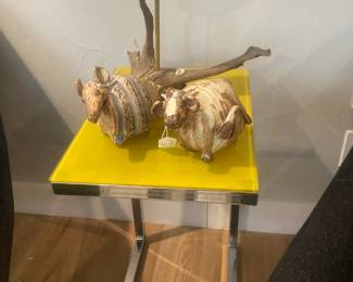 Yellow glass top side table, Wood carved duck, Clay Armadillo and Cow