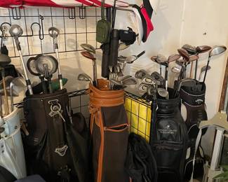 Golf clubs, bags, Busnell pinseeker, umbrellas, rain gear, storage rack and more!