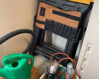 Extension cords, saw horse with tool caddy, watering can and more