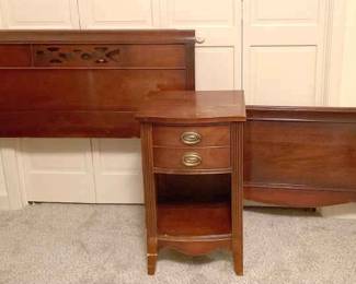 A Pair Of Twin Beds And Side Table